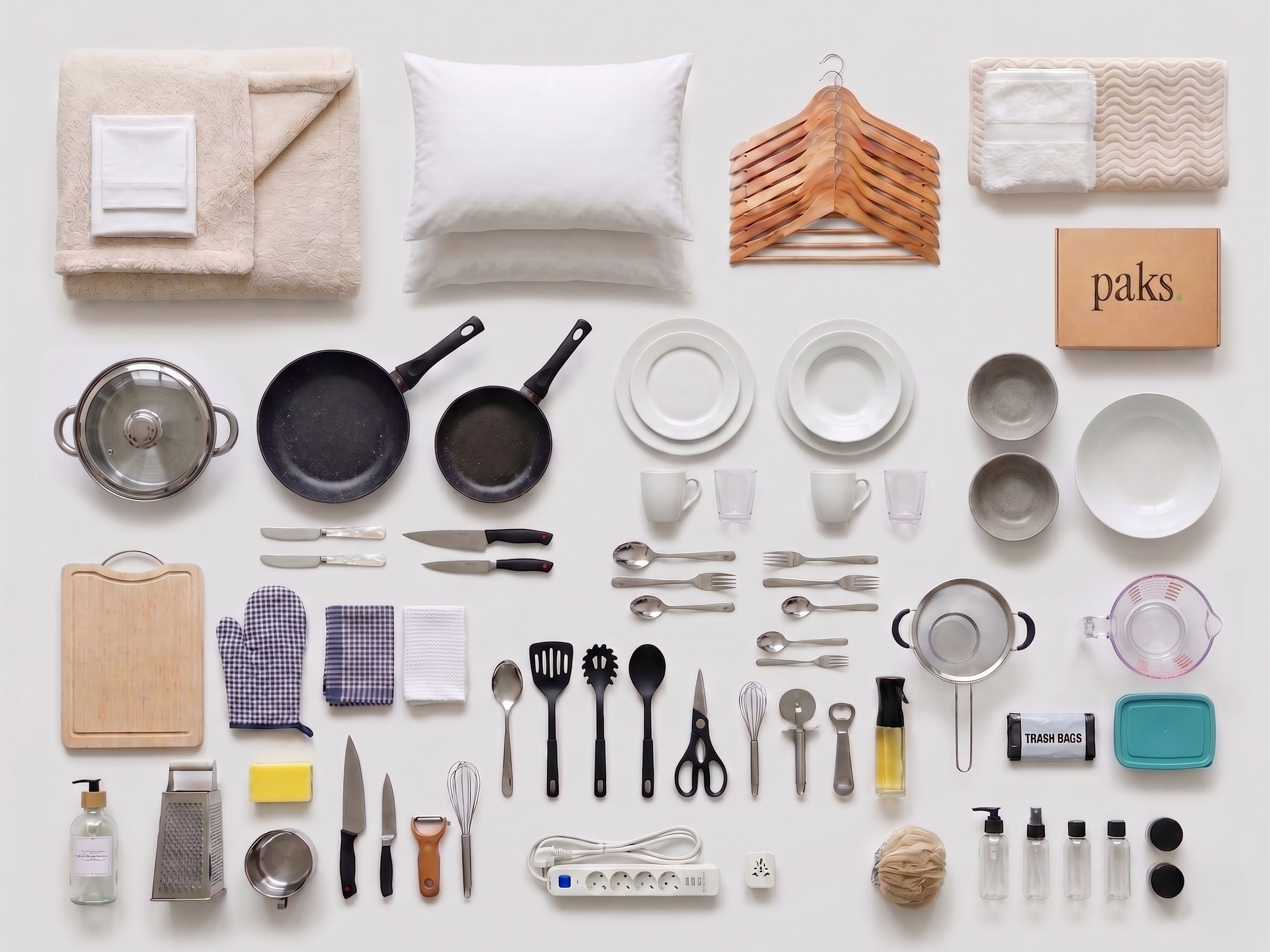 Complete Premium pak — bedding, kitchen, and bath in a knolling-style flat lay